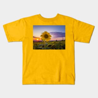 Sunflower against sunset Kids T-Shirt